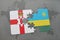 puzzle with the national flag of northern ireland and rwanda on a world map