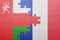 Puzzle with the national flag of oman and france