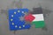 puzzle with the national flag of palestine and european union on a world map
