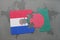 puzzle with the national flag of paraguay and bangladesh on a world map