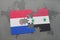 puzzle with the national flag of paraguay and syria on a world map