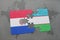 puzzle with the national flag of paraguay and uzbekistan on a world map