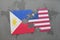 puzzle with the national flag of philippines and liberia on a world map