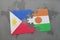 puzzle with the national flag of philippines and niger on a world map
