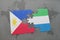 puzzle with the national flag of philippines and sierra leone on a world map