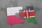 puzzle with the national flag of poland and kenya on a world map background.