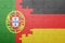 Puzzle with the national flag of portugal and germany