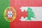 Puzzle with the national flag of portugal and lebanon