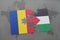 puzzle with the national flag of romania and palestine on a world map