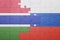 puzzle with the national flag of russia and gambia