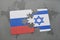 puzzle with the national flag of russia and israel on a world map background.