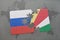 puzzle with the national flag of russia and seychelles on a world map background.