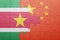 Puzzle with the national flag of suriname and china