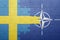 Puzzle with the national flag of sweden and nato