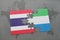 puzzle with the national flag of thailand and sierra leone on a world map