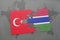 puzzle with the national flag of turkey and gambia on a world map