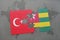 puzzle with the national flag of turkey and togo on a world map