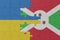 puzzle with the national flag of ukraine and burundi . macro.concept