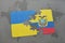 puzzle with the national flag of ukraine and ecuador on a world map
