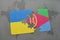 puzzle with the national flag of ukraine and eritrea on a world map