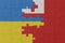 puzzle with the national flag of ukraine and Tonga . macro.concept