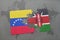 puzzle with the national flag of venezuela and kenya on a world map