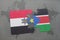 puzzle with the national flag of yemen and south sudan on a world map