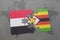 puzzle with the national flag of yemen and zimbabwe on a world map