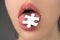 Puzzle pieces. Addiction Solution. life problems. Drug addiction. Female mouth with puzzle piece.