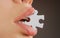 Puzzle pieces. Jigsaw solution. Love problems. Female mouth with puzzle piece.