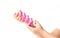 Puzzle pink plastic snake in the hands of a child on a white background, collected pattern