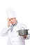 Puzzled chef holding a pan with the bad food on a white