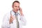 Puzzled doctor talking on a mobile phone