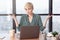 Puzzled Lady Shrugging Shoulders Gesturing With Hands Sitting In Office