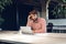 Puzzled thoughtful businessman sitting at his working table in an office