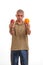 Puzzled young man confused, what to choice between an apple an an orange