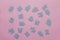 Puzzles on a pink background as a symbol of autism. Conceptual vision of the problem of autistic children