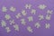 Puzzles on a purple background as a symbol of autism. Conceptual vision of the problem of autistic children