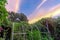 PVC arbor trellis with vine vegetable and flower garden under dramatic sunrise sky in Texas, USA