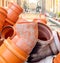 PVC sewer pipe joint plastic pipework orange road work surfacing