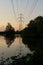 Pylon and bird reflecting into fishing lake