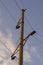 Pylon of high-voltage power lines on background of the sky in the clouds