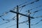 Pylon with high voltage power lines in bright sunshine