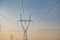 Pylon with insulatros and lines, wires. High voltage transmission line.