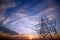 Pylon and power lines at sunset