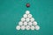 Pyramid of billiard balls on table