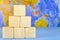 The pyramid is built of wooden cubes on the background of the world map. Banner mockup for design montage, business