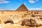 The Pyramid of Cheops and stones in the desert of Giza, Egypt