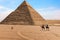 The Pyramid of Chephren and bedouins in the desert of Giza, Egypt