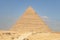 Pyramid of Chephren on a blue sky background. Great Pyramids of Giza in the desert. second pyramid